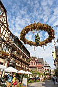 Picturesque timbered houses, 14th century Altes Haus (Old House) and harvest crown in Bacharach, Rhineland-Palatinate, Germany, Europe