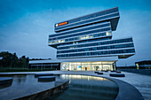 main building of research campus of BOSCH company at night, SFP Architects, Renningen, Baden-Wuerttemberg, Germany