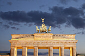 the illuminated Brandenburg Gate and square Pariser Platz in Berlin, Germany, Europe.