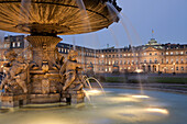 fountain on Schlossplatz square and the New Palace in Stuttgart at night, Baden-Württemberg, Germany, Europe.