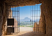 On background Peña de los Enamorados ´The Lovers´ Rock´, the mountain is also popularly known as ´Montaña del Indio´ because it looks like the head of an Indian when seen from certain angles, view from the Dolmen of Menga, Menga megalithic dolmen, 3rd mil