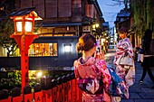 women dressed in kimono, in Shirakawa-minami-dori, Gion district, Kyoto. Kansai, Japan.