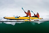 Lindblad Expeditions guests kayaking amongst ice in Neko Harbor, Antarctica.
