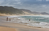 People bathing in the Indian Ocean in iSimangaliso-Wetland Park, South Africa, Africa