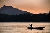 Asia. South-East Asia. Laos. Province of Luang Prabang, city of Luang Prabang, World heritage of UNESCO since 1995. Fisherman on Mekong river.