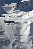 ski slopes in Swiss Alps above famous resort Saas-Fee, Valais, Switzerland.