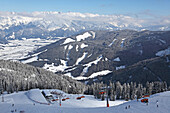 View from the Riederfeld downhill run over Saaletal valley and Saalfelden, Pinzgau, Salzburger Land