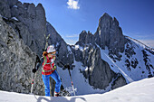 Woman back-country skiing ascending to Grosswand, Bischofsmuetze in background, Grosswand, Gosau range, Dachstein, Salzburg, Austria