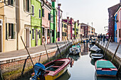 Canal with boats and colorful houses on island Burano. Venice, Veneto region, Italy, Europe.