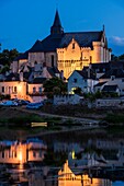 Collegiate Church of Saint-Martin (12th and 13th centuries) and the Candes-Saint-Martin Village (Labeled The Most Beautiful Villages of France) at Twilight. It overlooks the confluence of the Vienne and Loire rivers from a steep hill on the left bank of t