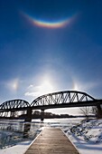Circumzenithal arc shines brightly above the sun and sun dogs along the Missouri River in eastern Nebraska on a bitter January day.