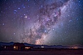 Scorpius rising over Atacama Lodge near San Pedro de Atacama in Chile (latitude -23°). Taken in March 2010 with modified Canon 5DMkII and Sigma 50mm lens at f/2.8 for stack of 4 x 1.5 minute exposures at ISO 800. Ground is from one frame.