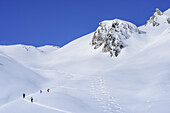Several persons back-country skiing ascending to Sonnenjoch, Sonnenjoch, Kitzbuehel Alps, Tyrol, Austria