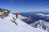 Woman back-country skiing ascending to Hasenoehrl, Hasenoehrl, valley of Ultental, Ortler Range, South Tyrol, Italy