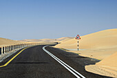 Road through the sand dunes of the empty quarter desert. United Arab Emirates, UAE, Abu Dhabi, Liwa Oasis, Moreeb Hill, Tal Mireb.