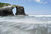 Hole rock in a beach called Praia das Catedrais in the north coast of Spain, Lugo, Spain.
