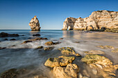 Ocean waves and cliffs at sunrise, Praia da Marinha, Caramujeira, Lagoa Municipality, Algarve, Portugal, Europe