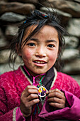 A little Buddhist girl in the Tsum Valley, Manaslu region, Nepal, Asia