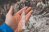 A man holds a section of frost heave ground  Frost heaving (or a frost heave) is an upwards swelling of soil during freezing conditions caused by an increasing presence of ice as it grows towards the surface, upwards from the depth in the soil where freez