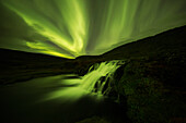 'Northern lights over Dynjandi in the Westfjord region of Iceland, Dynjandi is a series of seven waterfalls; Westfjords, Iceland'