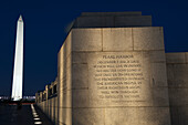 'Inscription at the World War II Memorial with the Washington Monument in the background; Washington, District of Columbia, United States of America'