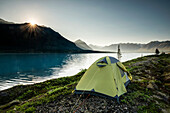 Scenic view of Lower Twin Lake with a backpacking tent in the foreground, Lake Clark National Park & Preserve, Southcentral Alaska