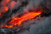 'Flowing lava and steam on a hawaiian island; Island of Hawaii, Hawaii, United States of America'