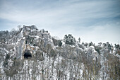 the Rusen Castle (ruin) and the Great Cave arch which is situated below in winter, Blaubeuren, Alb-Danube district, Swabian Alb, Baden-Wuerttemberg, Germany