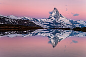 Switzerland, Vallese, the Matterhorn at sunrise reflected at Stellisee, Zermatt valley