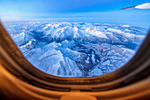 Aerial view of the snowy alps in flight towards Oslo Norway Europe