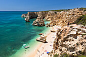 Top view of cliffs and turquoise water of the ocean Praia da Marinha Caramujeira Lagoa Municipality Algarve Portugal Europe