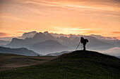 Alpe di Siusi/Seiser Alm, Dolomites, South Tyrol, Italy. Photographer waiting for the sunrise