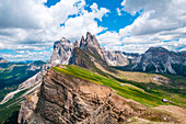 Great view from the top of Seceda mountains (2500m) on the bigs rocky peaks, up Val di Funes valley. Dolomiti, Trentino Alto Adige, Italy.