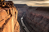 A woman rappelling off Toroweap Overlook above the Colorado River, Grand Canyon National Park, Fredonia, Arizona.