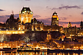 Canada, Quebec Province, Quebec Citys, Old Town listed World Heritage by UNESCO, panorama by night from Saint Lawrence River bank, Chateau Frontenac and Petit Champlain District