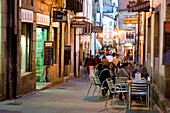Spain, Galicia, Santiago de Compostela, listed as World Heritage by UNESCO, Rua de la Reina, terrace of a bar