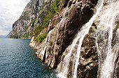 Norway, Rogaland County, Lysebotn Fjord, waterfall falling in the Lysefjord