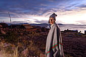 Peru, Puno Province, Titicaca lake, Llachon, 4000 m of altitude, the nights are fresh and and the poncho made of alpaga is useful