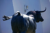 Spain, Andalusia, white village of Ronda, bull statue outside the Plaza de Toros
