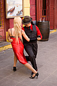Argentina, Buenos Aires, La Boca District, tango dancers couple