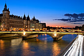 France, Paris, area listed as World Heritage by UNESCO, the Conciergerie on the Ile de la Cite (City island) and the pont au Change (Change bridge) illuminated