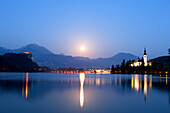 Slovenia, Gorenjska region, on the island of the Bled lake, church of the Assumption with the Julian Alps in the background