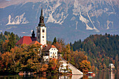 Slovenia, Gorenjska region, on the island of the Bled lake, church of the Assumption with the Julian Alps in the background