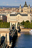 Hungary, Budapest, the Danube river, the Chain Bridge (Szechenyi Lanchid) listed as World Heritage by UNESCO, the Gresham Palace, Art Nouveau style of 1907, today converted into a Hotel, the Gresham Palace and the Saint Stephen's Basilica