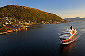 Norway, Troms County, Tromso harbour, the Coastal Express (Hurtigruten) in Tromsesundet Fjord