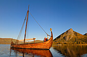 Norway, Nordland County, Lofoten Islands, Vestvagoy Island, Lofotr drakkar identically built on Borg Lake and the captain Terje Boe