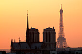 France, Paris, area listed as World Heritage by UNESCO, Notre Dame Cathedral and the Eiffel Tower at the sunset