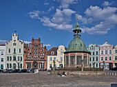 Waterworks and town houses on the market square in Wismar, Mecklenburg Vorpommern, Germany