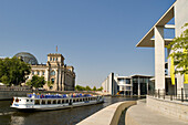 Germany, Berlin, Tiergaten district, the Reichstag and Marie Elisabeth Luders Haus by architect Stephan Braunfels view from the banks of the Spree