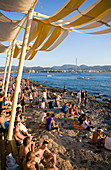 Spain, Balearic Islands, Ibiza island, Sant Antoni, every day at sunset, young people meet at the Cafe del Mar